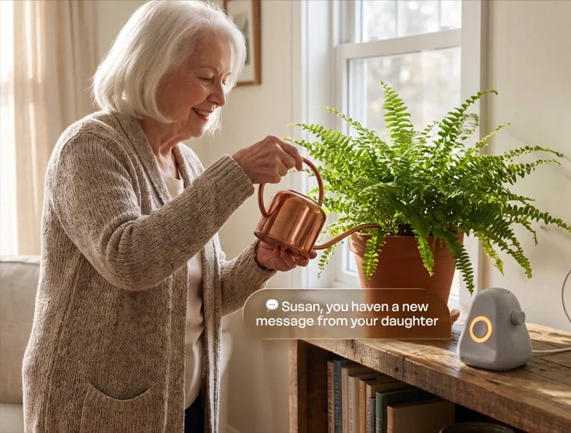 Older adult receiving a family message through Ato