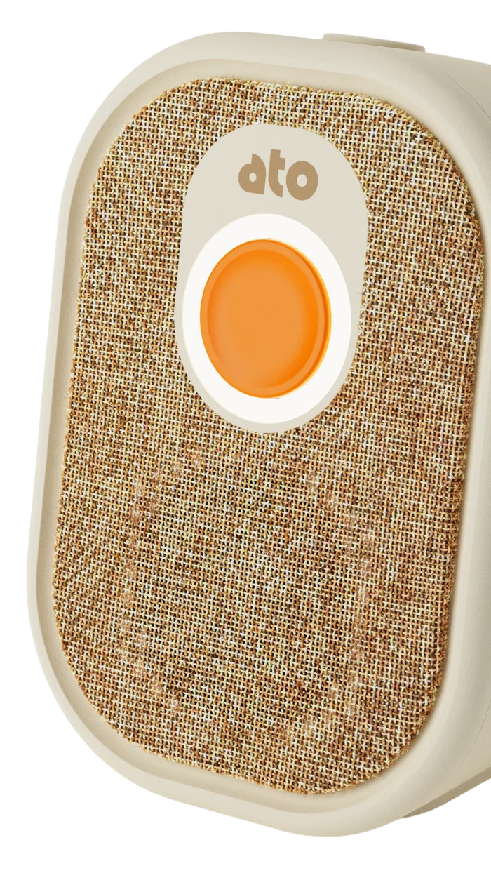 Close-up of Ato's fabric front and illuminated orange action button